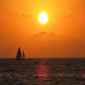 Image by Akiroq titled ’sunset, sailboat, nature’. Source: Pixabay