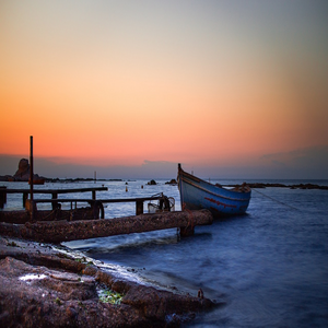 Image by Argy titled ’boat, sea, sunset’. Source: Pixabay