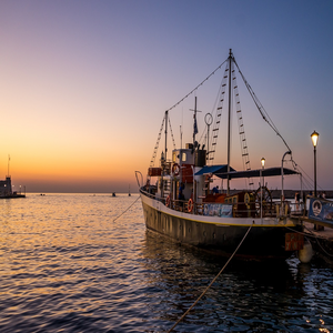 Image by Leonhard_Niederwimmer titled ’ship, port, sunset’. Source: Pixabay