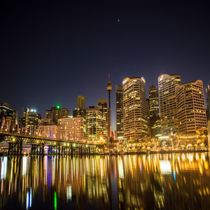 Image by pattyjansen titled ’cityscape, illuminated, darling harbour’. Source: Pixabay Image by pattyjansen titled ’cityscape, illuminated, darling harbour’. Source: Pixabay